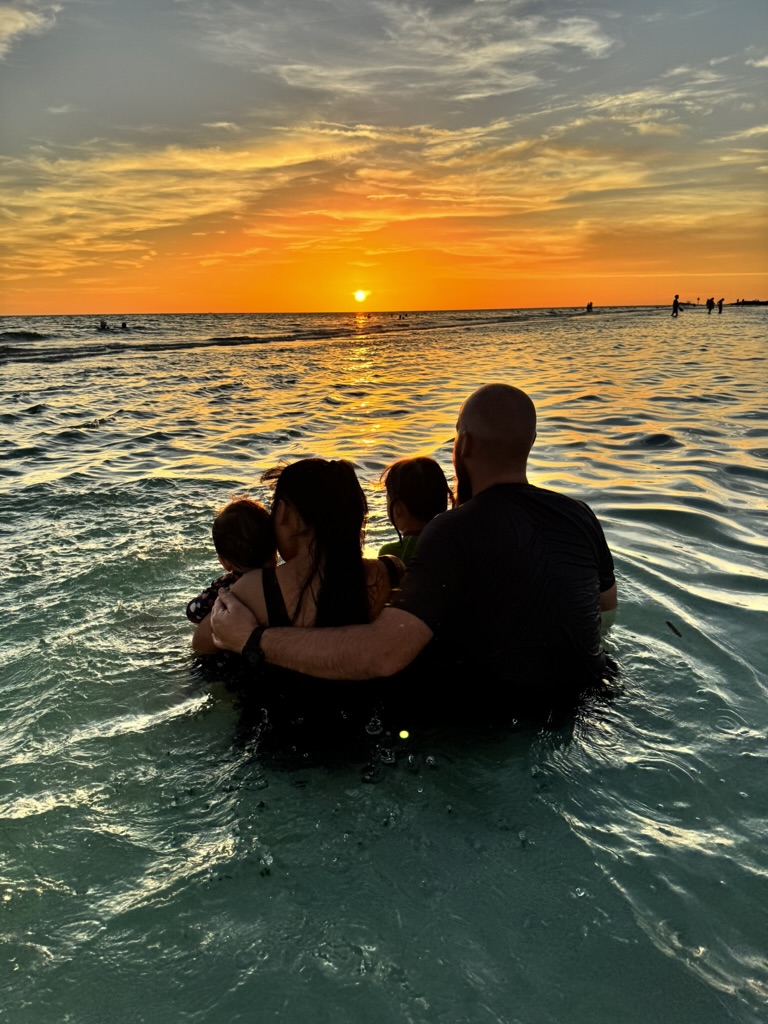 The White family together in the Gulf at sunset